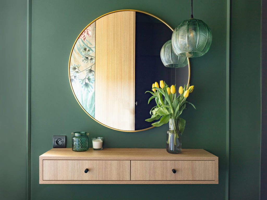 Dressing table with elegant round mirror. Interior design and home staging