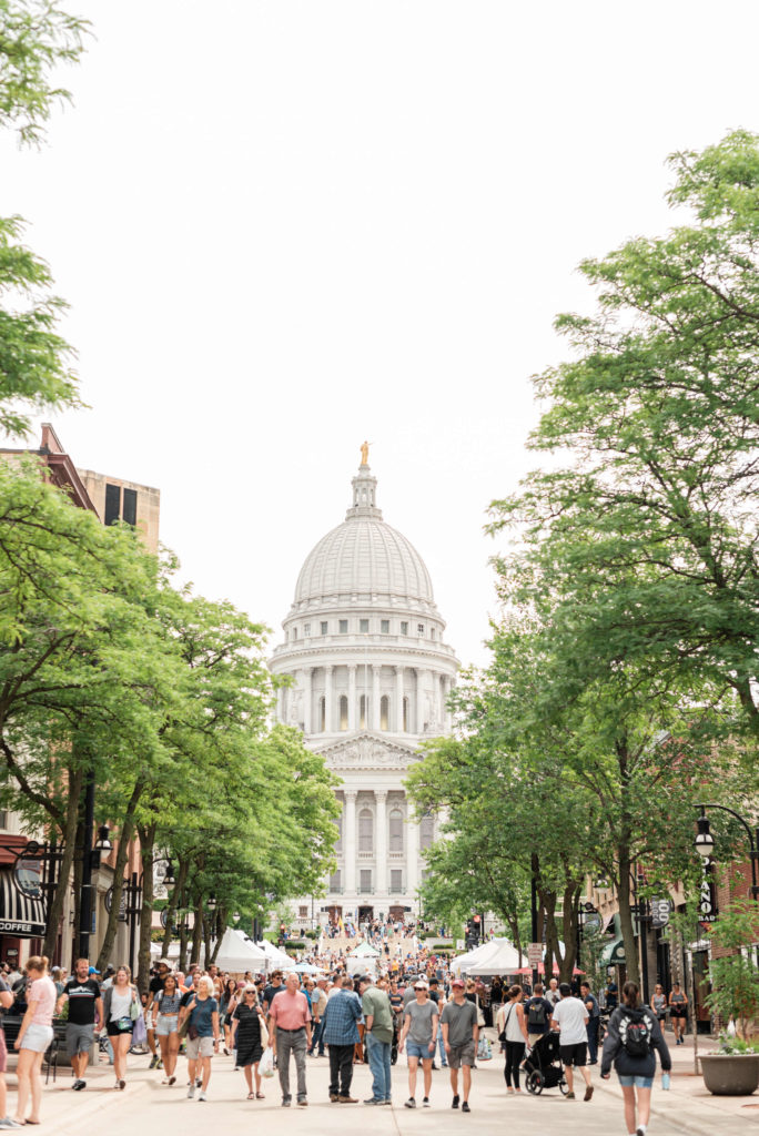 view of the madison capitol building during the summer farmers market